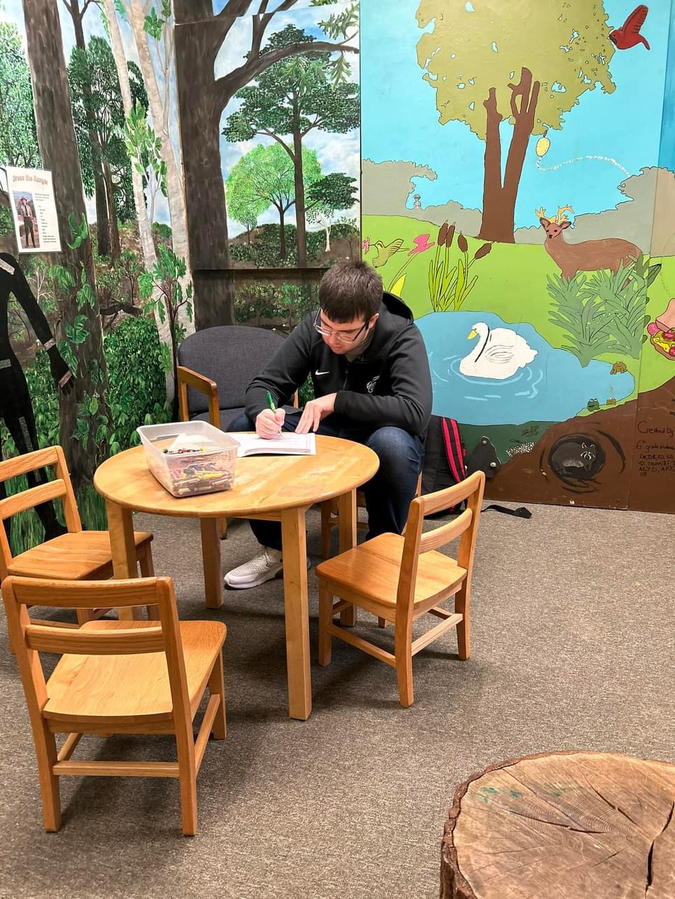 Billy at Rock Creek Nature Center and Planetarium (DC) in the little kids room filling out a Junior Ranger Booklet. Fun Fact: Rock Creek is the NPS Site with a Planetarium